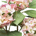 Nahaufnahme einer künstlichen rosa Hortensienblüte mit realistischen Blättern – perfekte Kunstpflanze für Dekoration