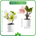 Hochwertige künstliche Magnolienblume mit zarten rosa Blüten und grünen Blättern