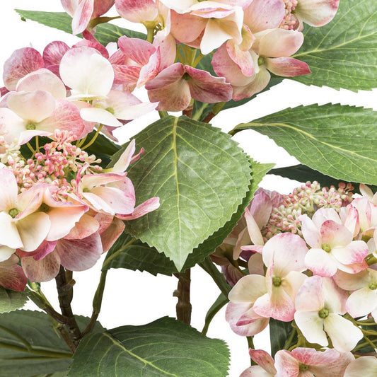 Nahaufnahme einer künstlichen rosa Hortensienblüte mit realistischen Blättern – perfekte Kunstpflanze für Dekoration