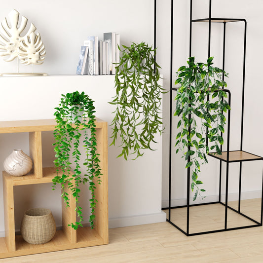 Detailaufnahme eines eleganten weißen Keramiktopfs mit künstlichem Eukalyptus