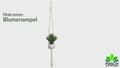 Nahaufnahme Makramee Blumenampel aus Baumwolle mit naturgetreuer Kunstpflanze